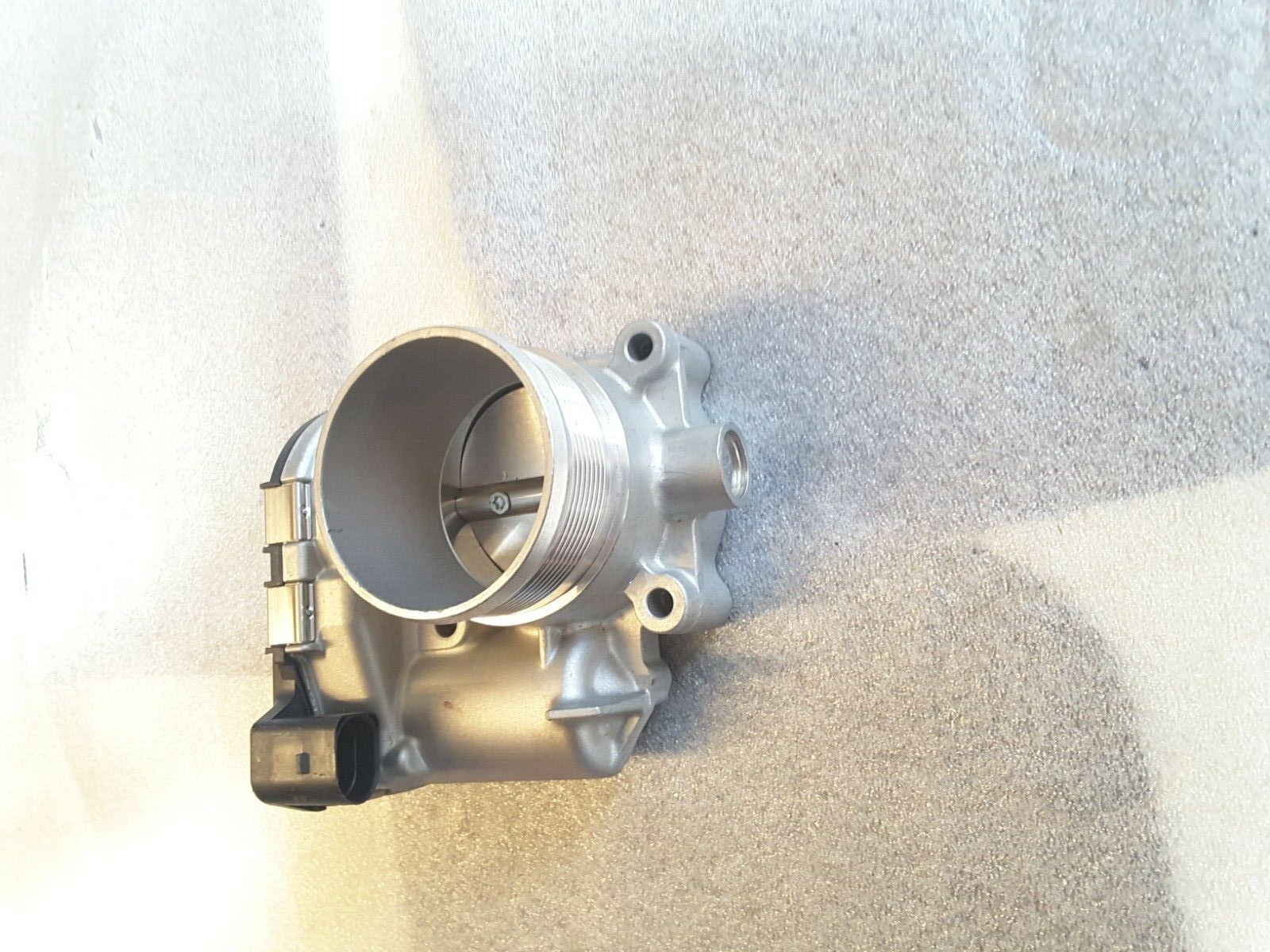 Throttle body original VW Passat TSI 06K133062C NEW.